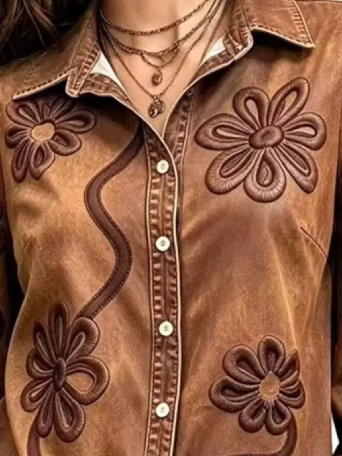 Brown floral-embroidered button-down shirt, collar and floral embroidery detail.