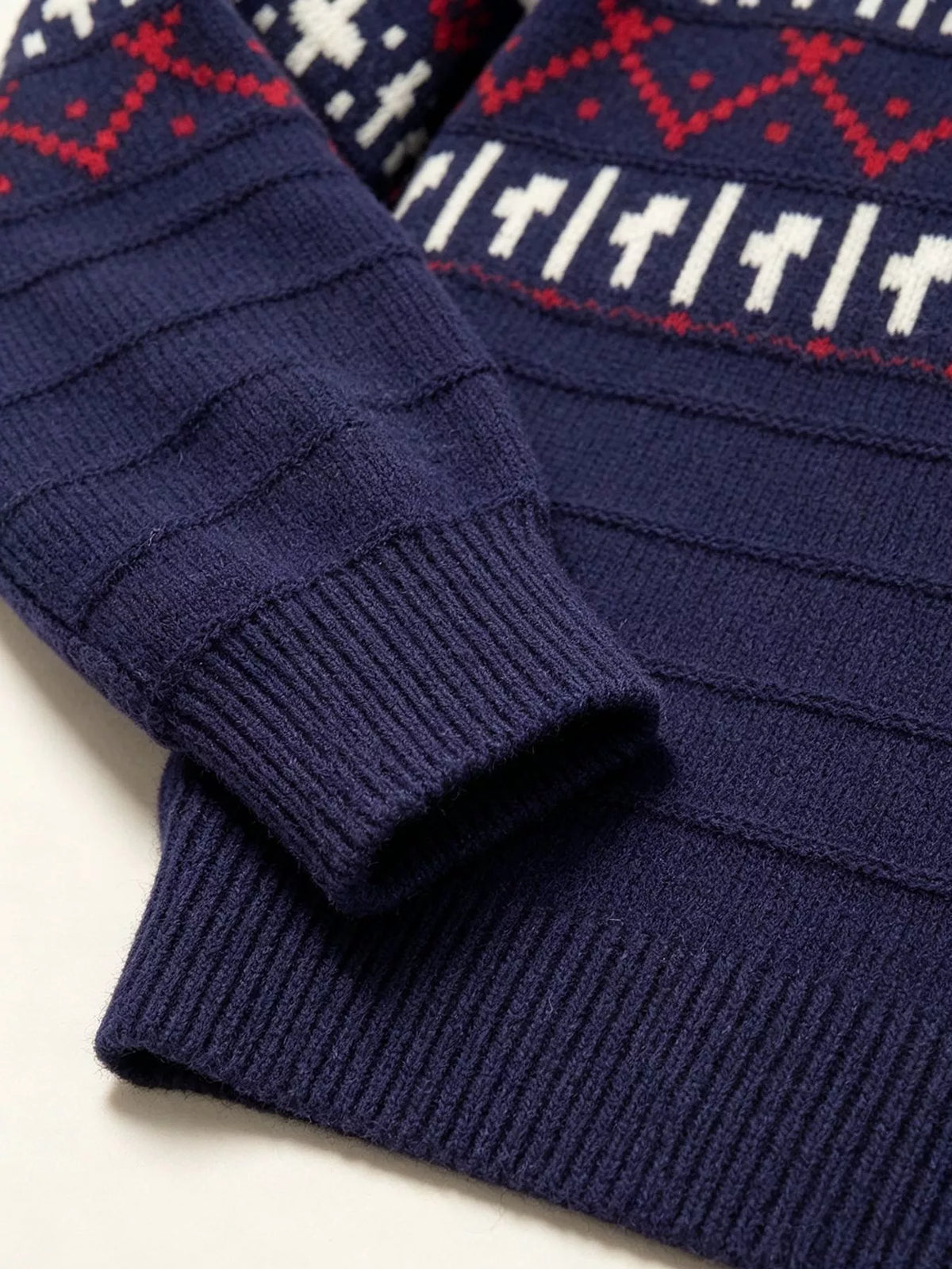 Navy fair isle polo-collar sweater, ribbed cuff and hem detail.