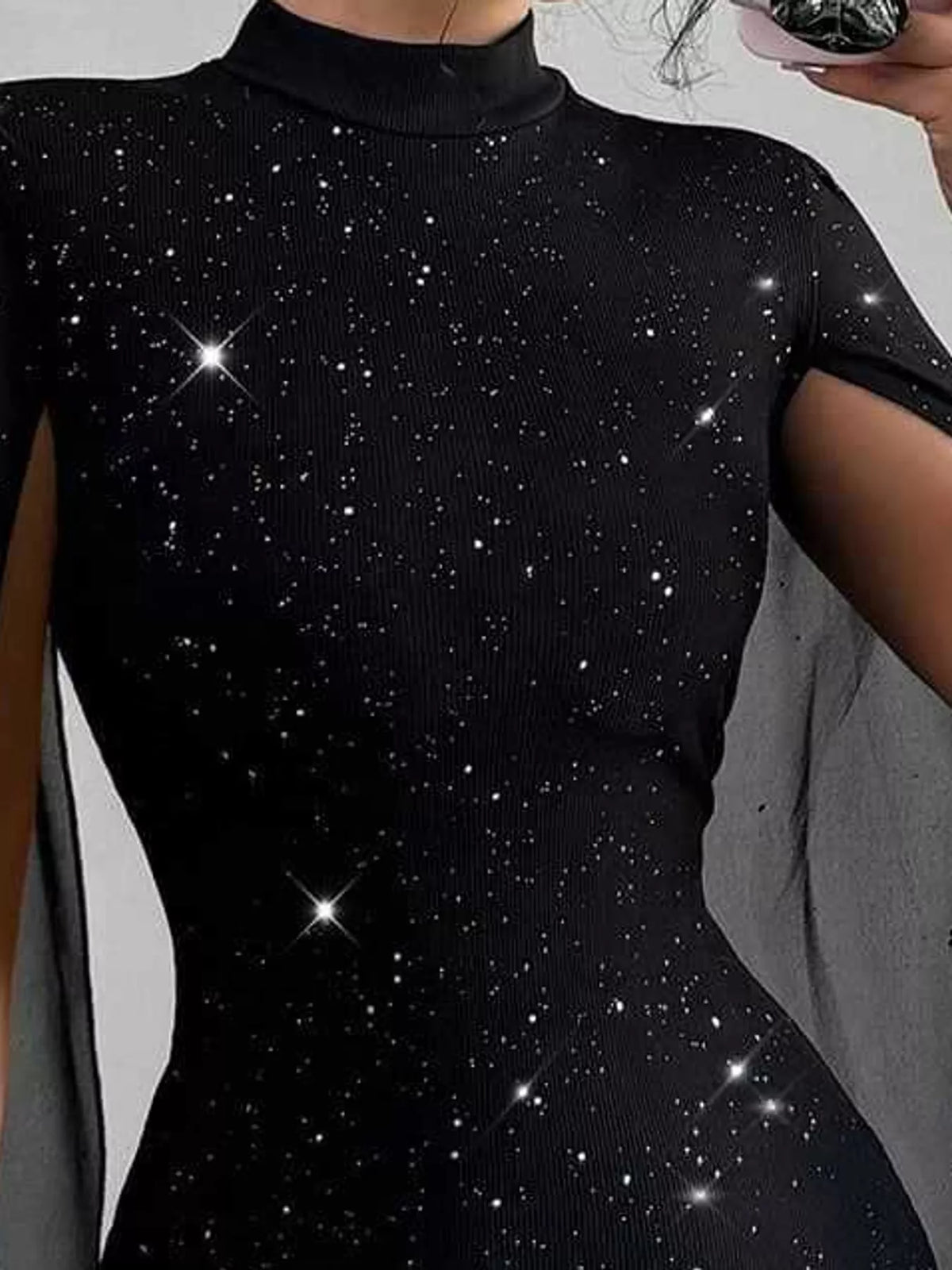 Black glitter mock neck cape-sleeve mini dress — design and construction details