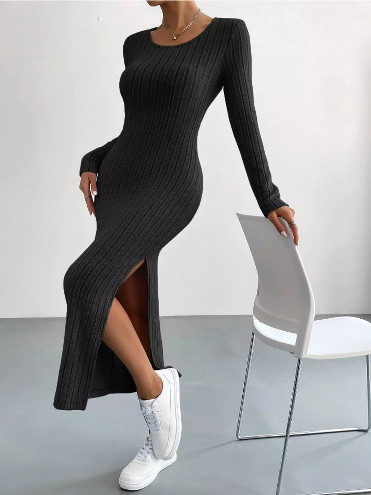Black ribbed long sleeve knit dress with side slit