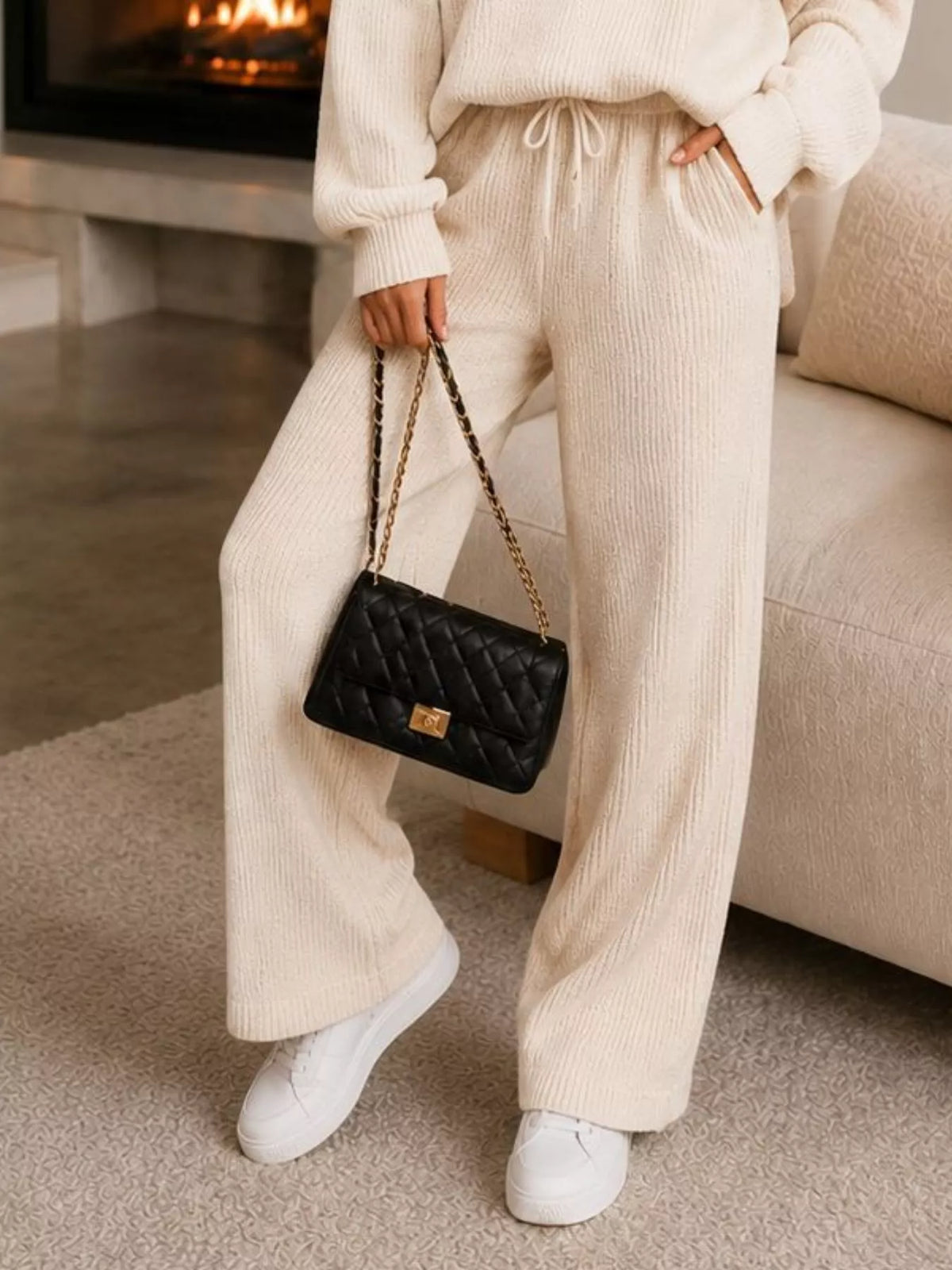 White quarter-zip knit top and pants set, pants detail