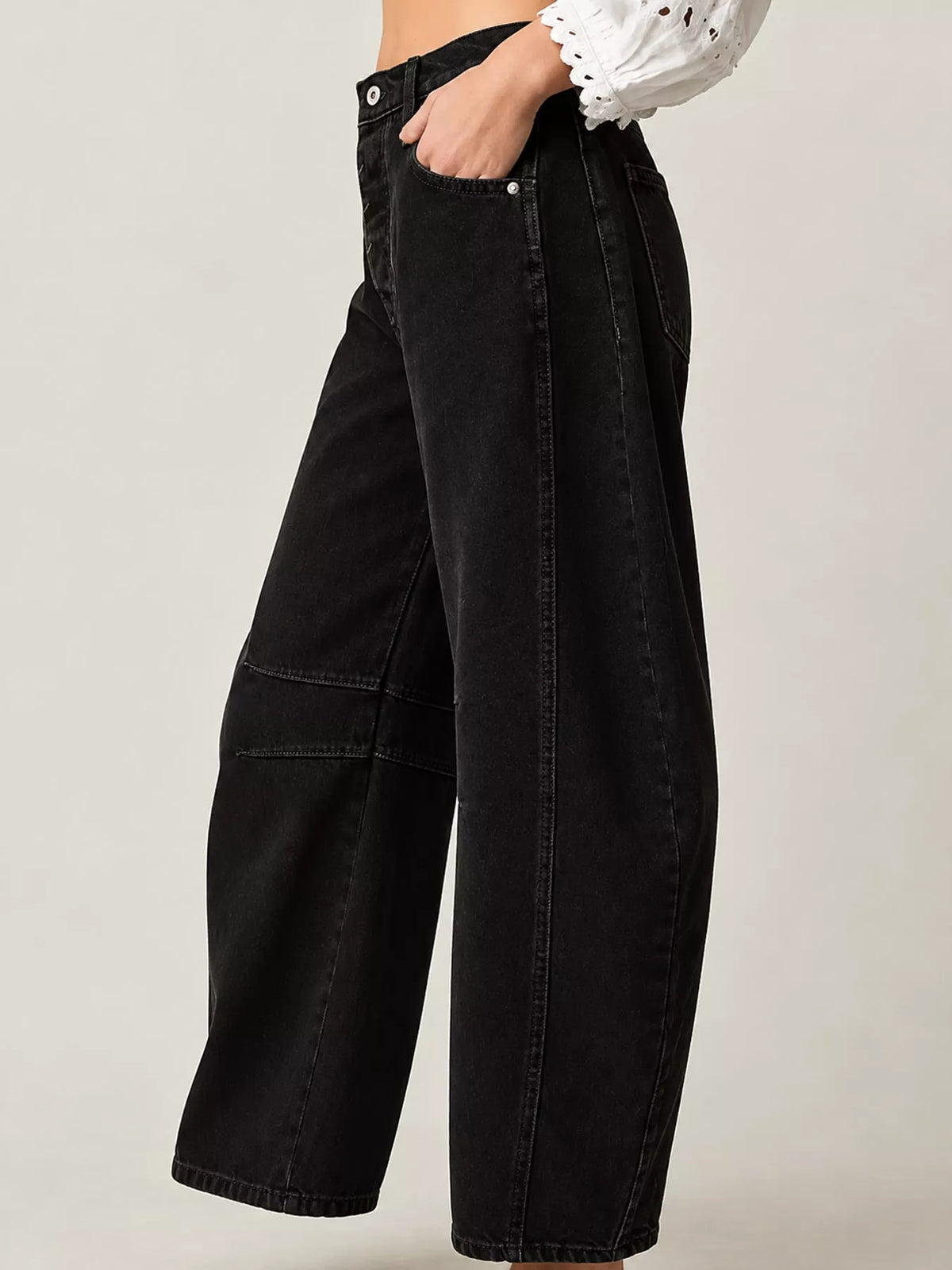 Black barrel-leg jeans, side view