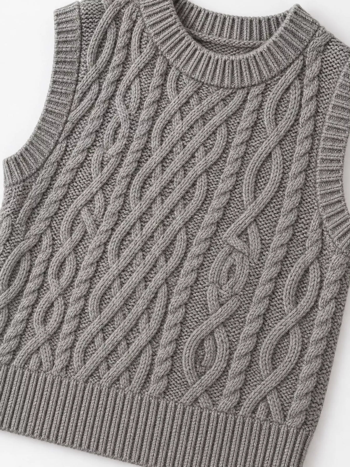 Gray cable-knit sweater vest, cable knit front laid flat