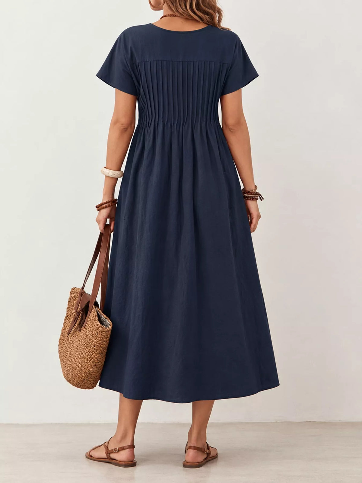 Pleated Midi Dress with Pockets, back view in navy blue