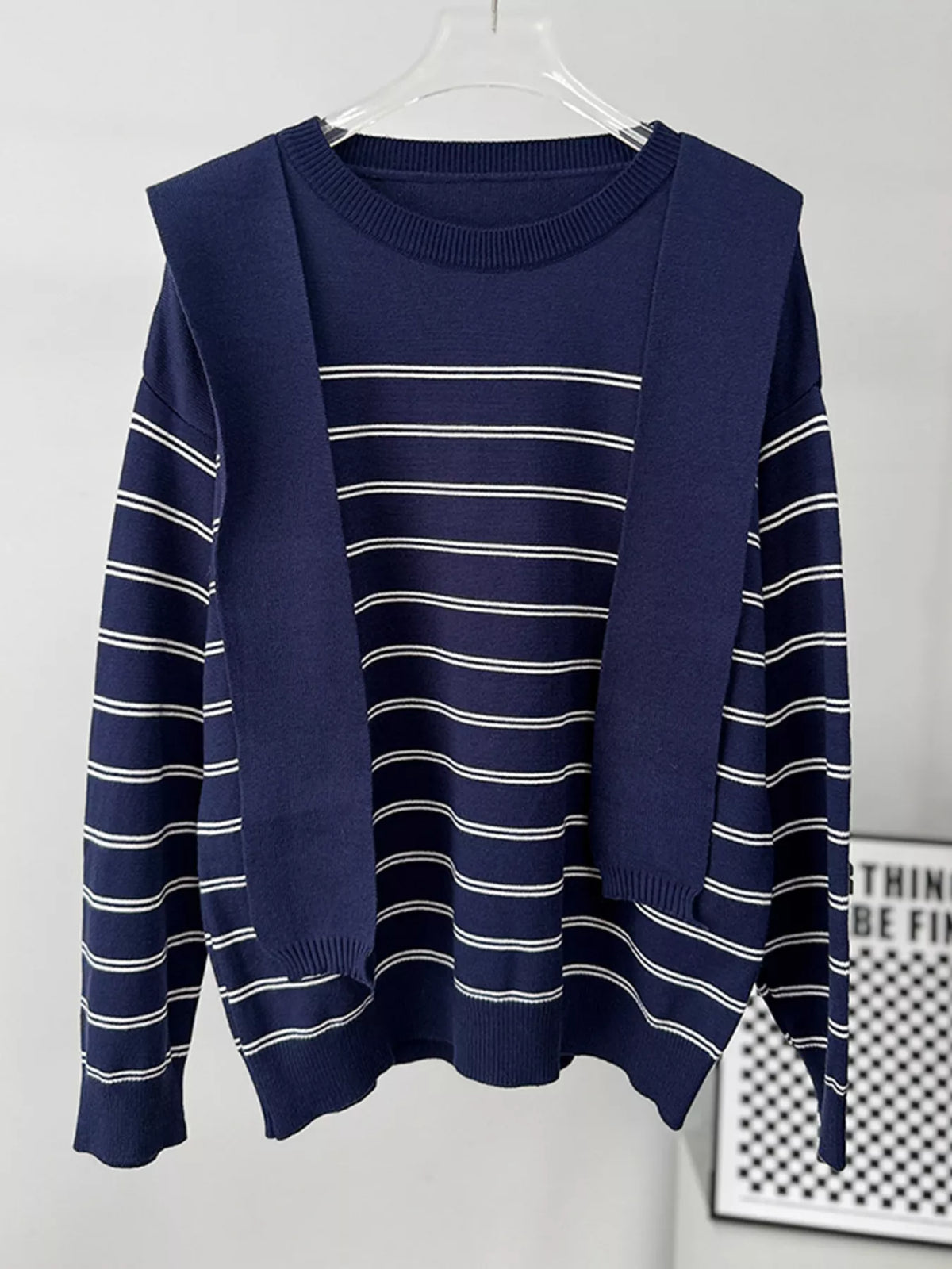 Striped crewneck sweater with layered tie detail in navy, hanging front view