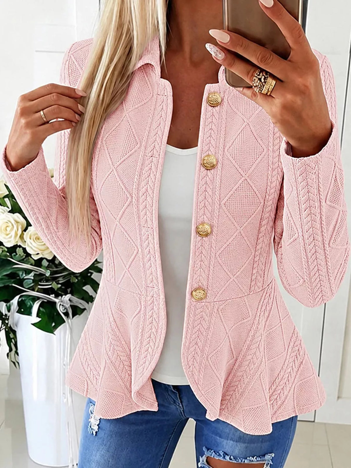 Pink cable-knit button-up cardigan — front view