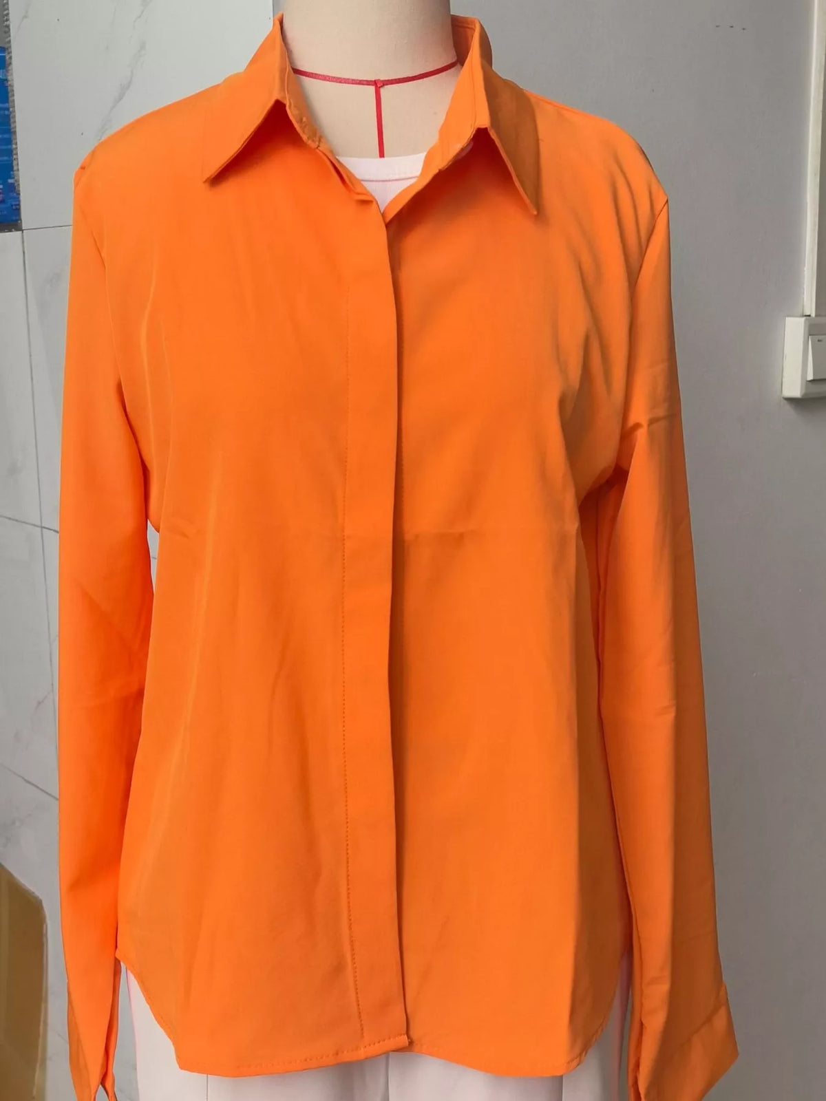 Button-up shirt, orange hanging front