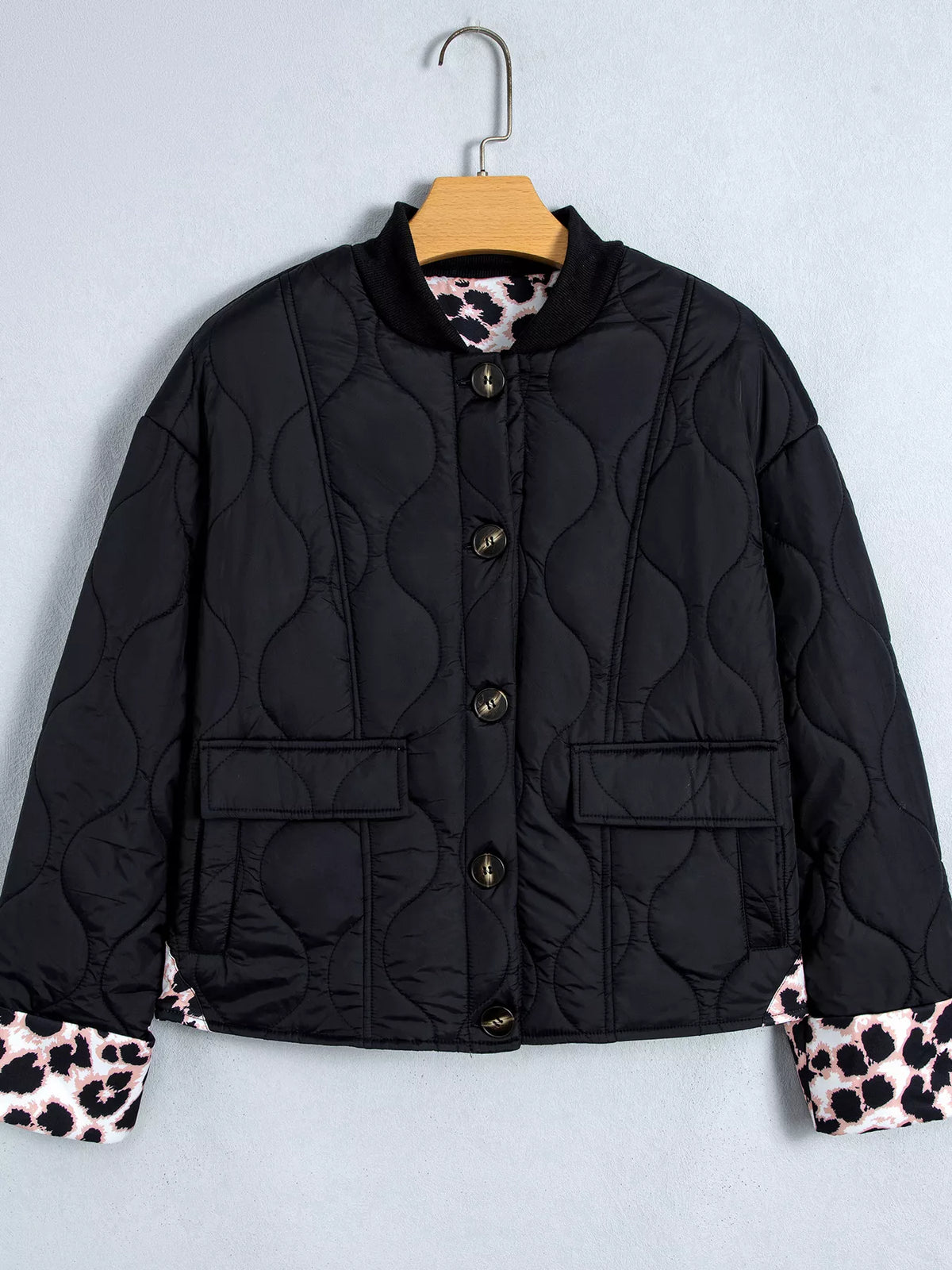 Quilted Leopard Cuff Button Down Puffer Jacket in black, front view