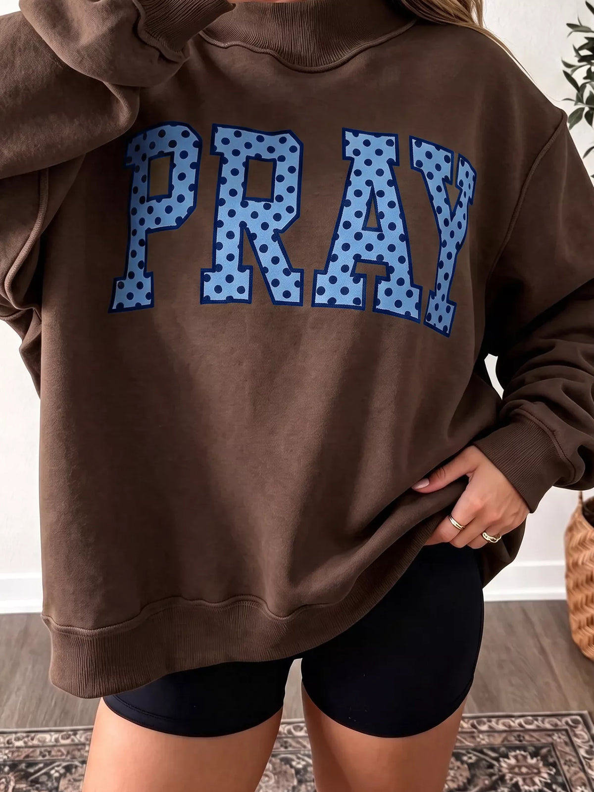 PRAY Polka Dot Embroidered Mock Neck Sweatshirt in dark brown, front view