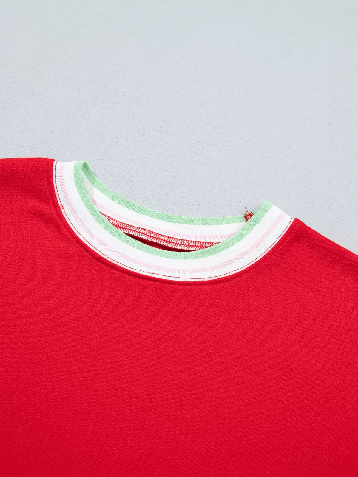 Red sweatshirt with contrast striped ribbed trim, neckline detail