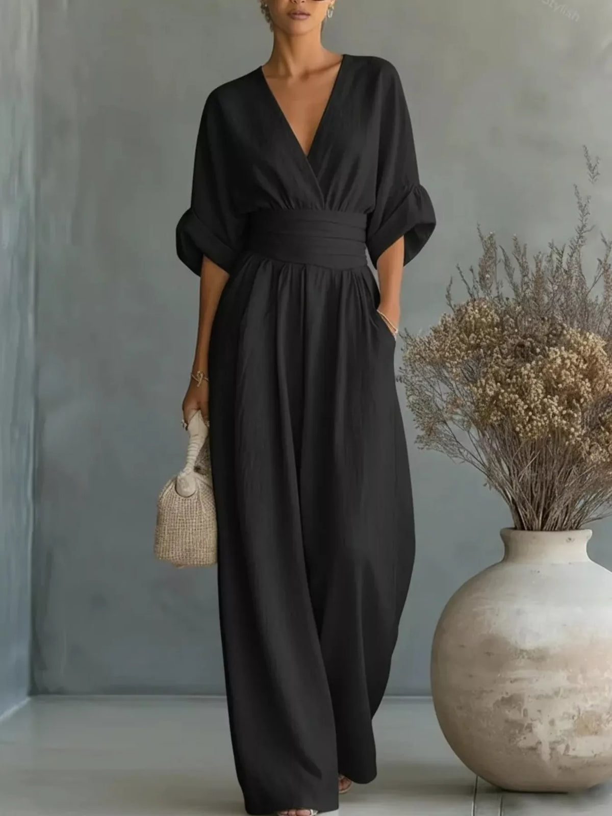 Black V-neck wide-leg jumpsuit, front view