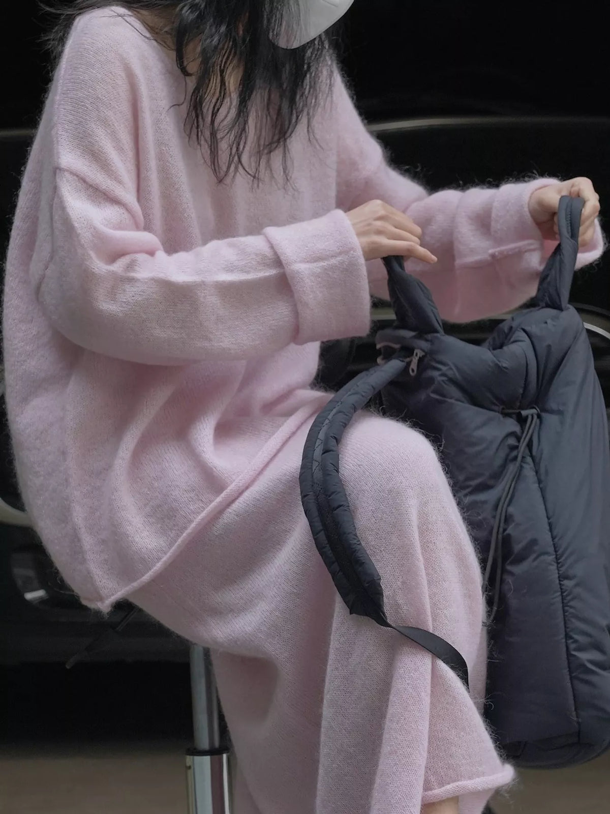 Pink round neck sweater, side view