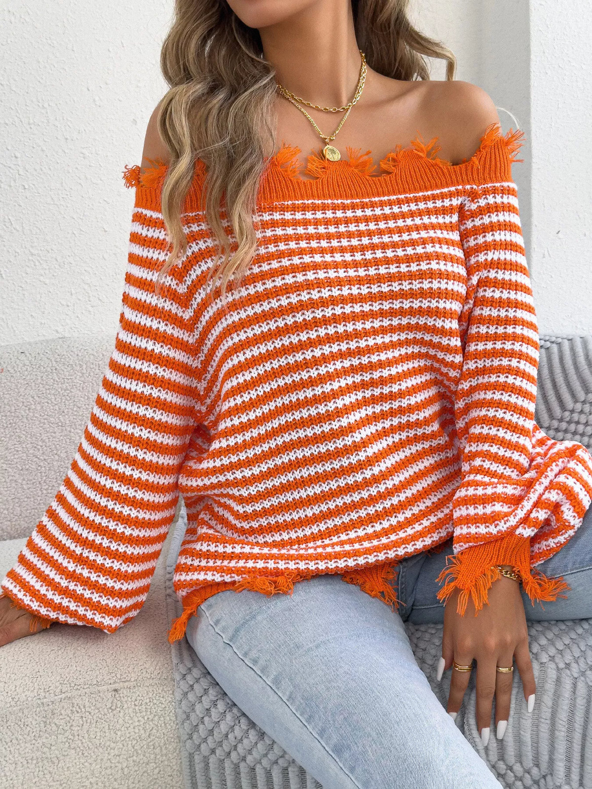 Orange off-shoulder frayed hem striped sweater