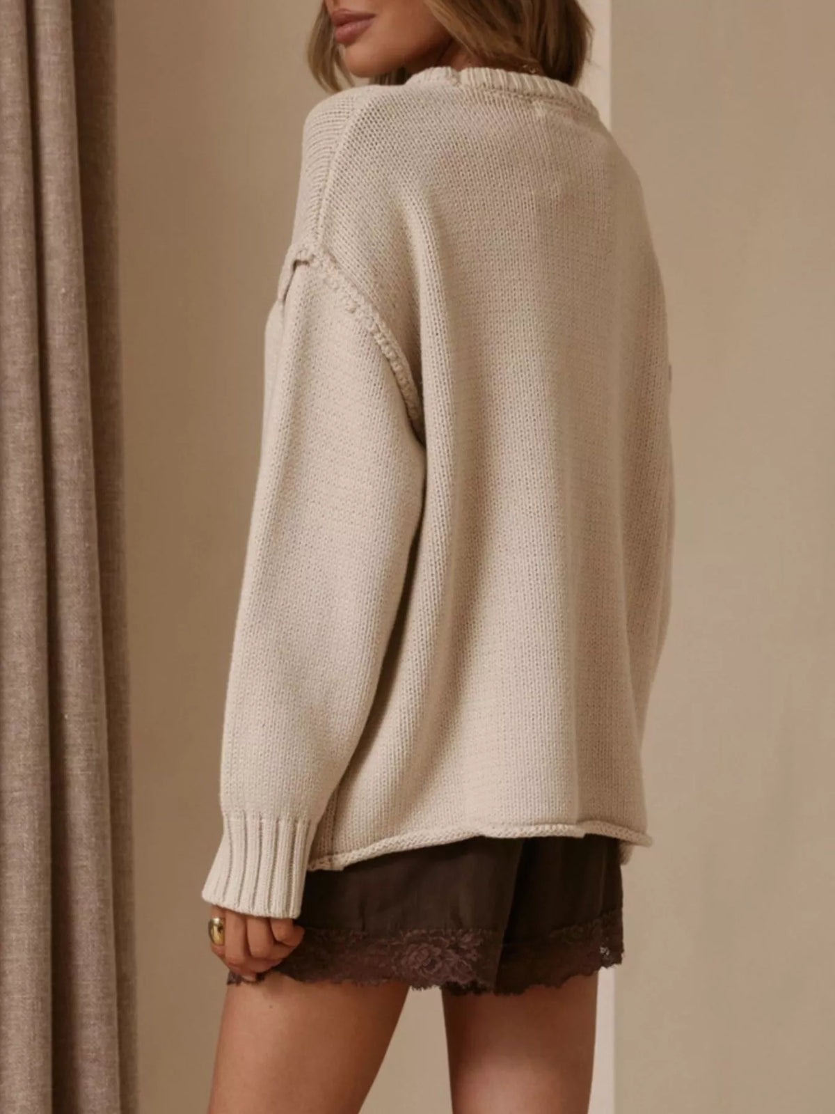 Ivory crewneck dropped-shoulder sweater, back view.