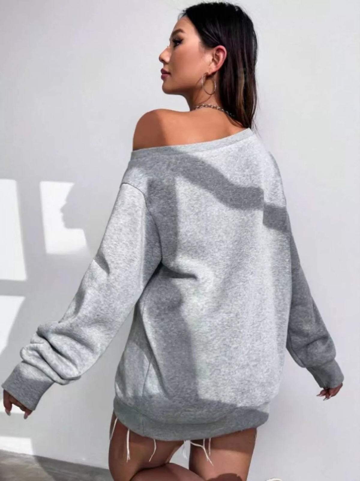 Gray asymmetric-neck sweatshirt, back view