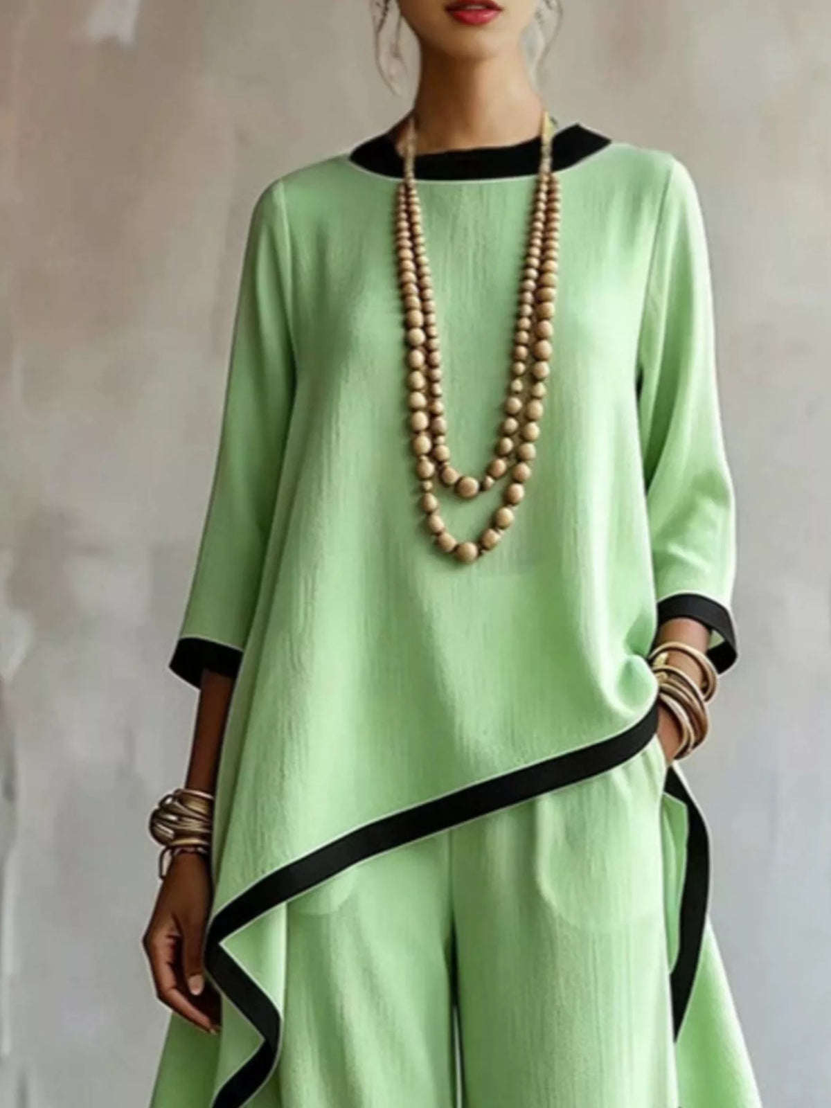 Green contrast-trim top and pants set, asymmetric top detail