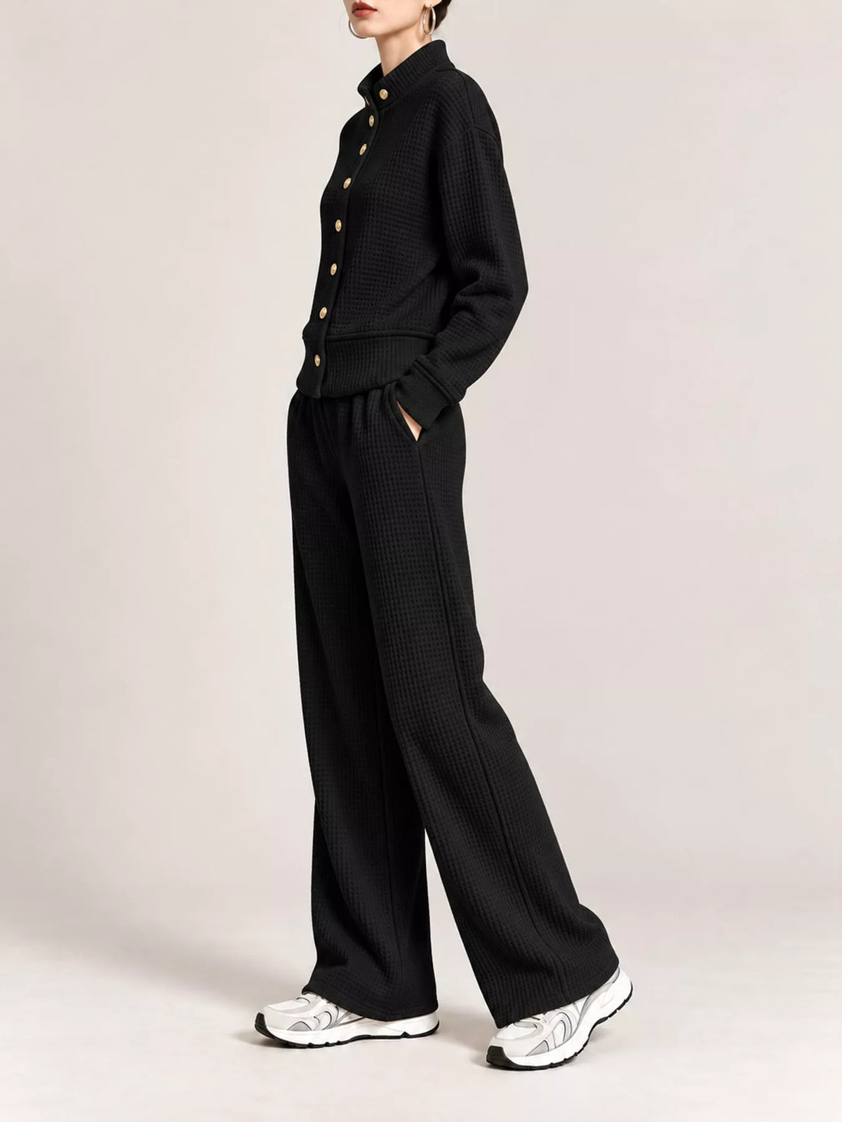 Black waffle knit button-up outerwear and wide-leg pants set