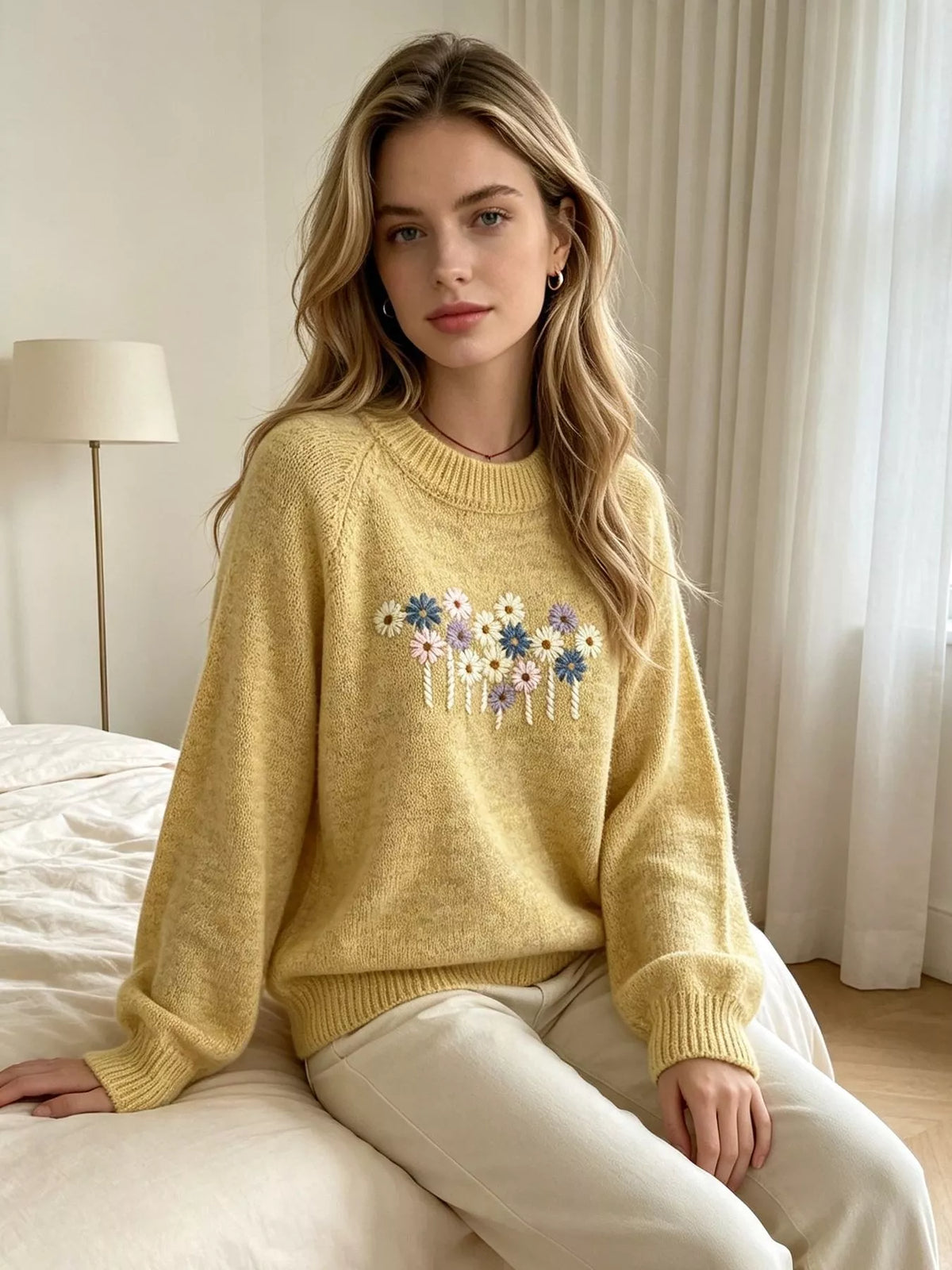 Floral embroidered round-neck sweater in yellow, seated view