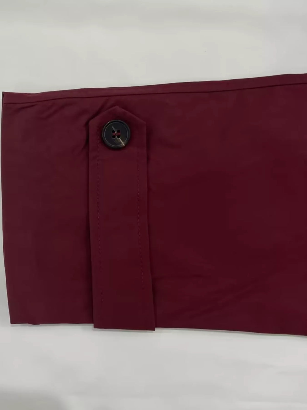 Women's Double-Breasted Belted Trench Coat in burgundy — cuff detail view