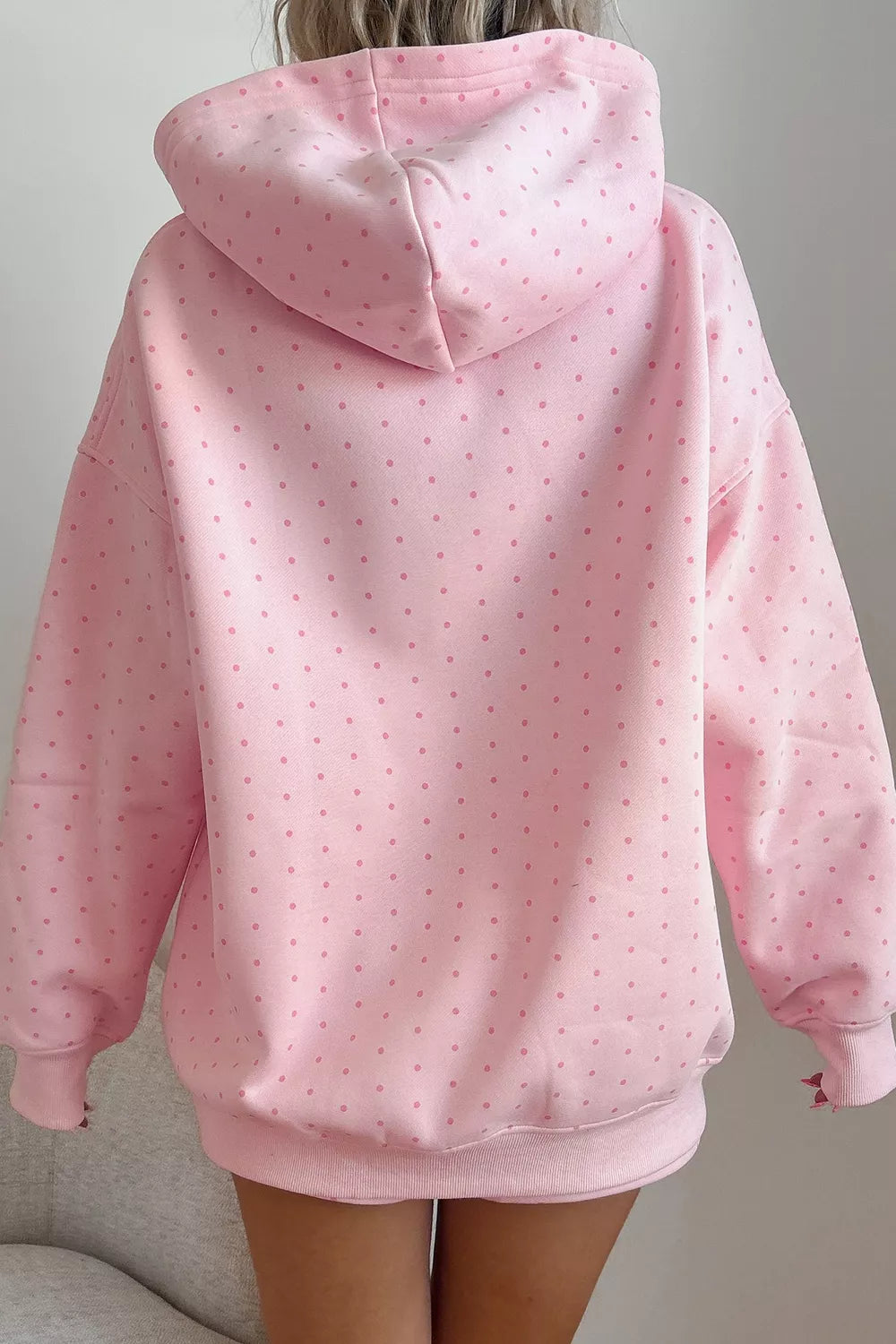 Pink polka dot oversized hoodie and shorts set — back view