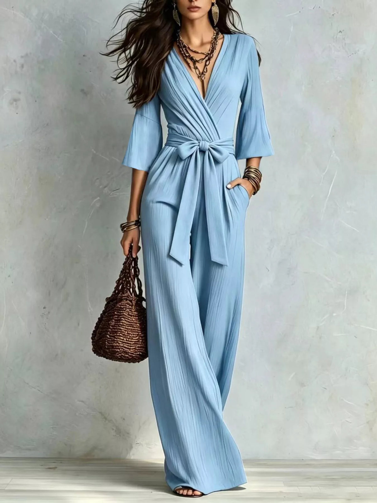 Light blue pleated wide-leg jumpsuit with tie-waist