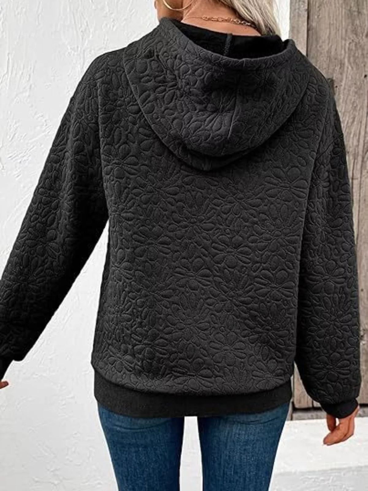 Black textured floral embossed drawstring hoodie, back view