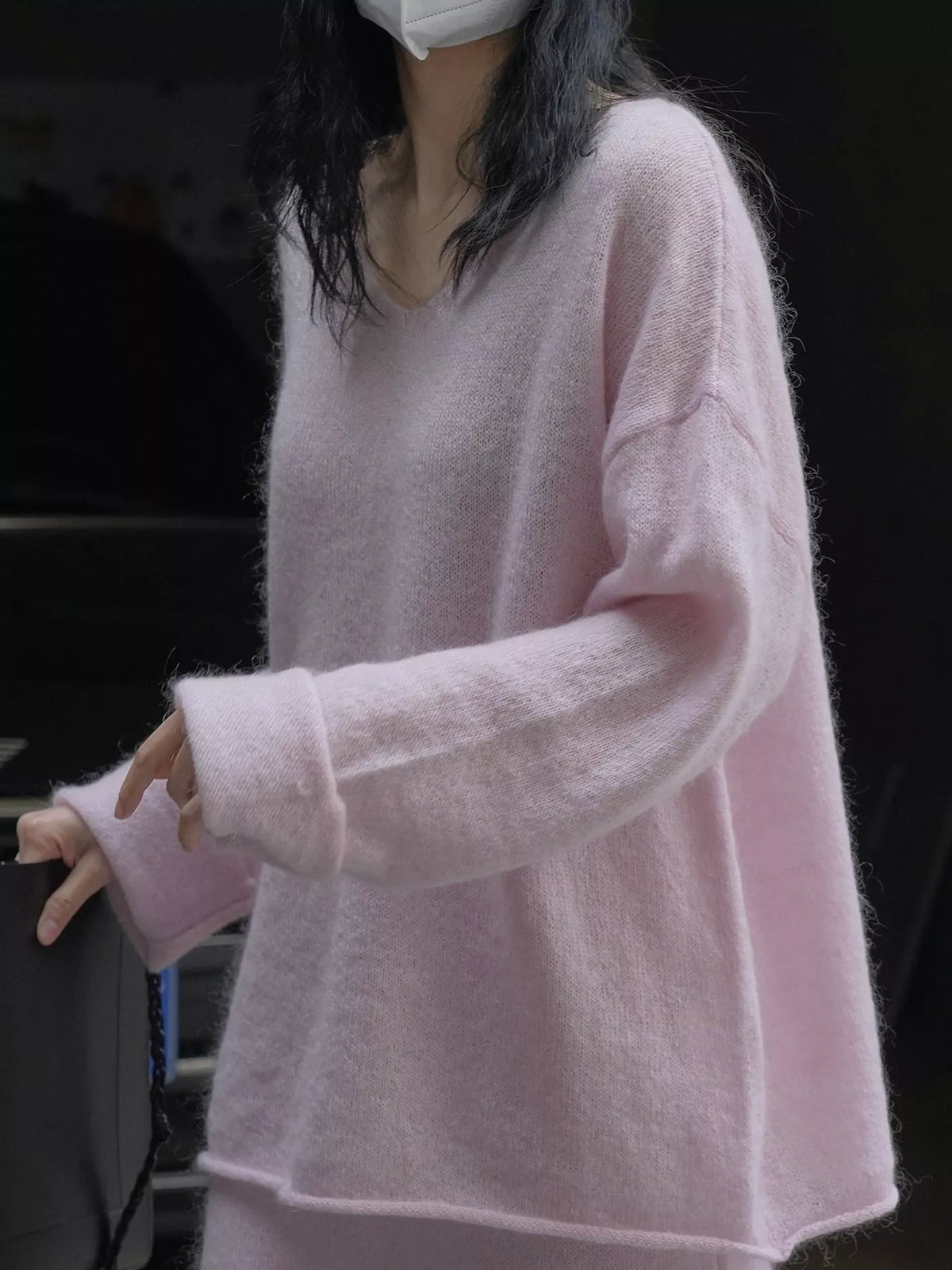 Pink round neck sweater, side view