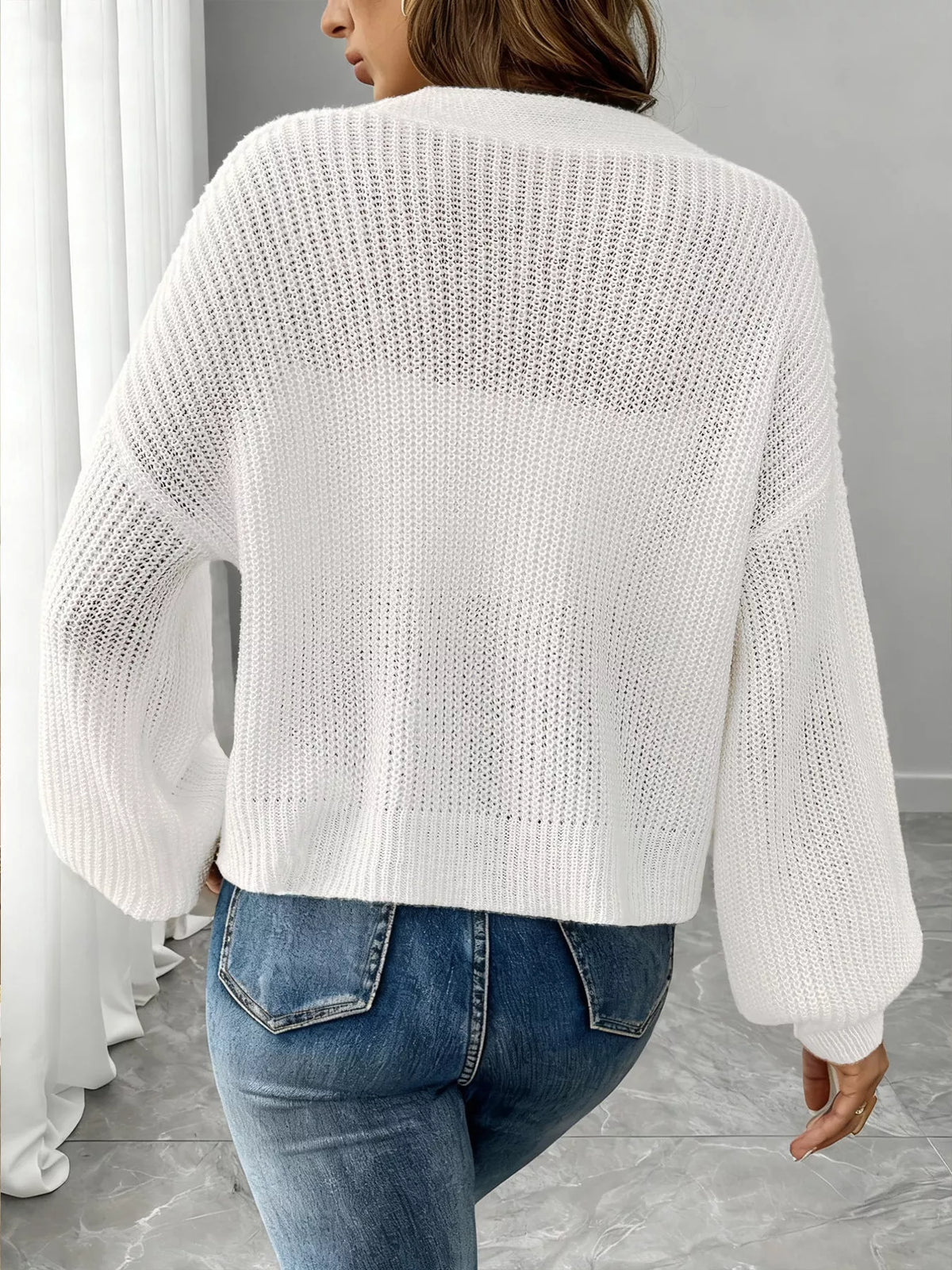 V-neck ribbed knit cardigan in white, back view