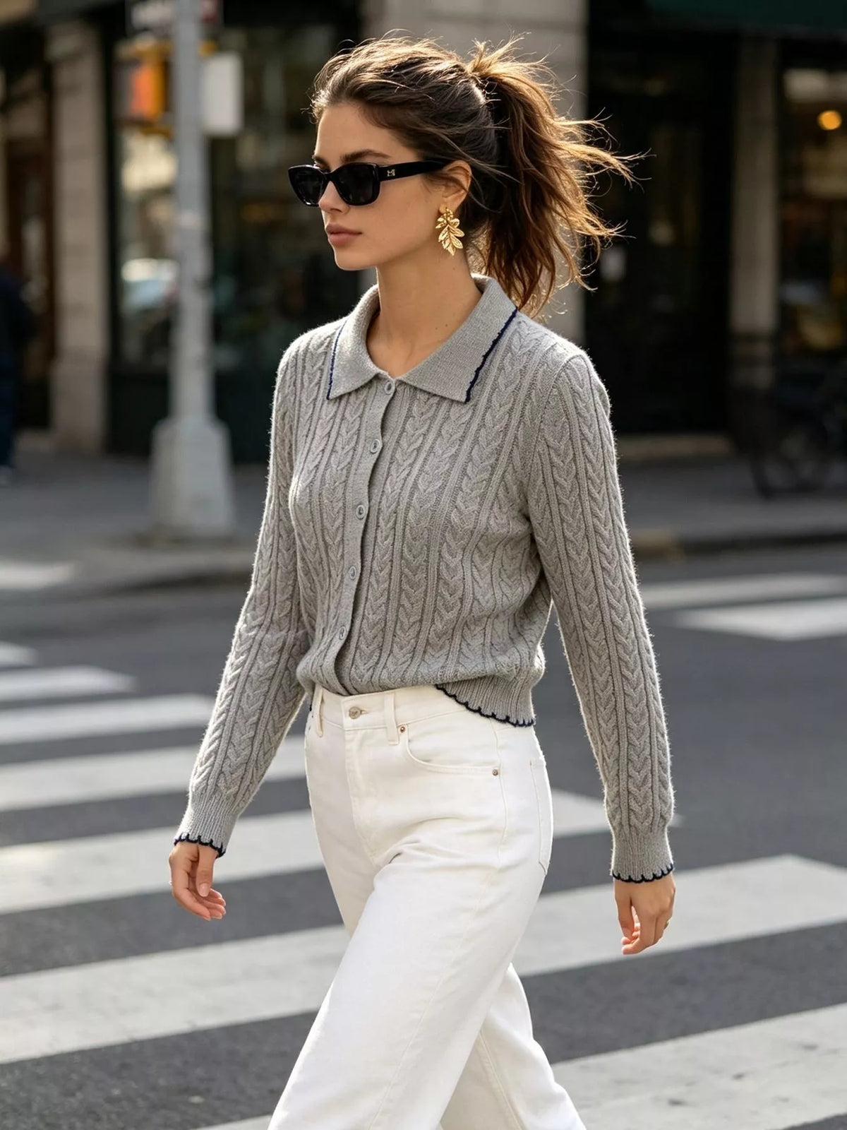 Gray cable-knit polo-collar cardigan, walking front view.