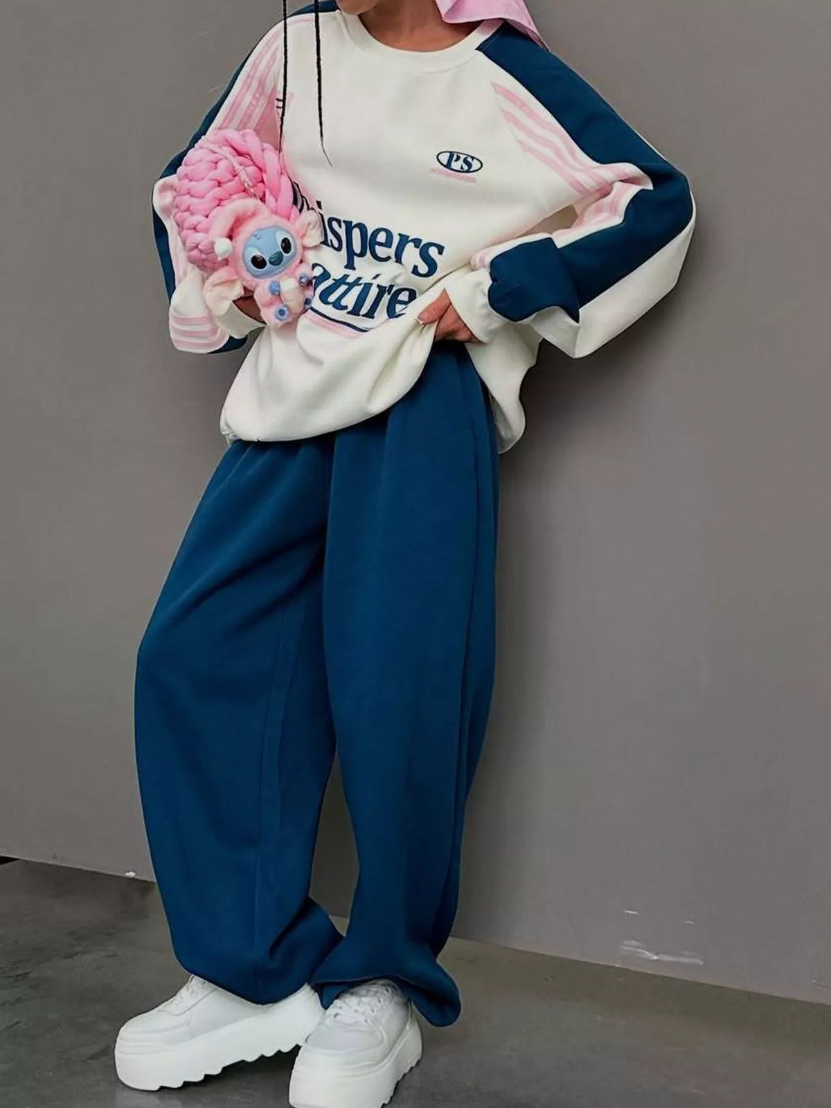 Cream top and navy pants color-block sweatshirt and wide-leg pants set — front view