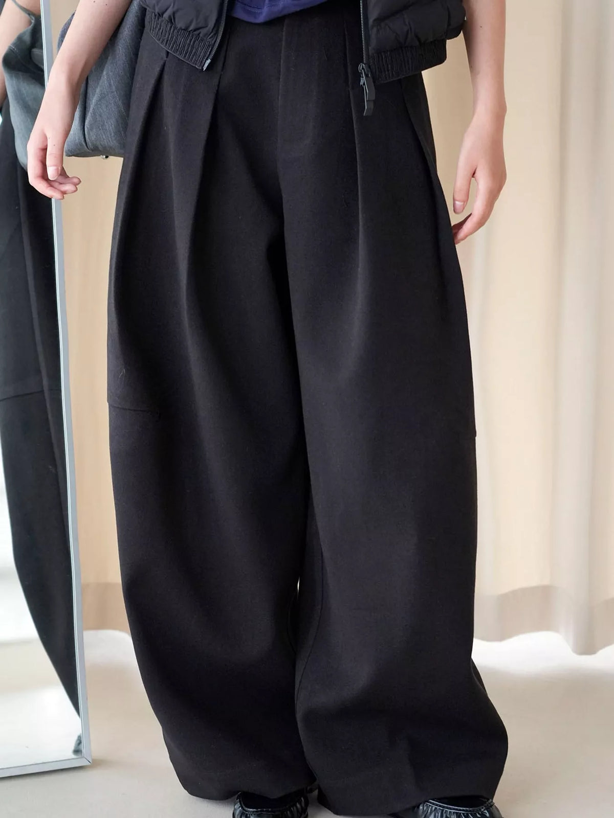 Pleated Wide-Leg Pants in black, front view