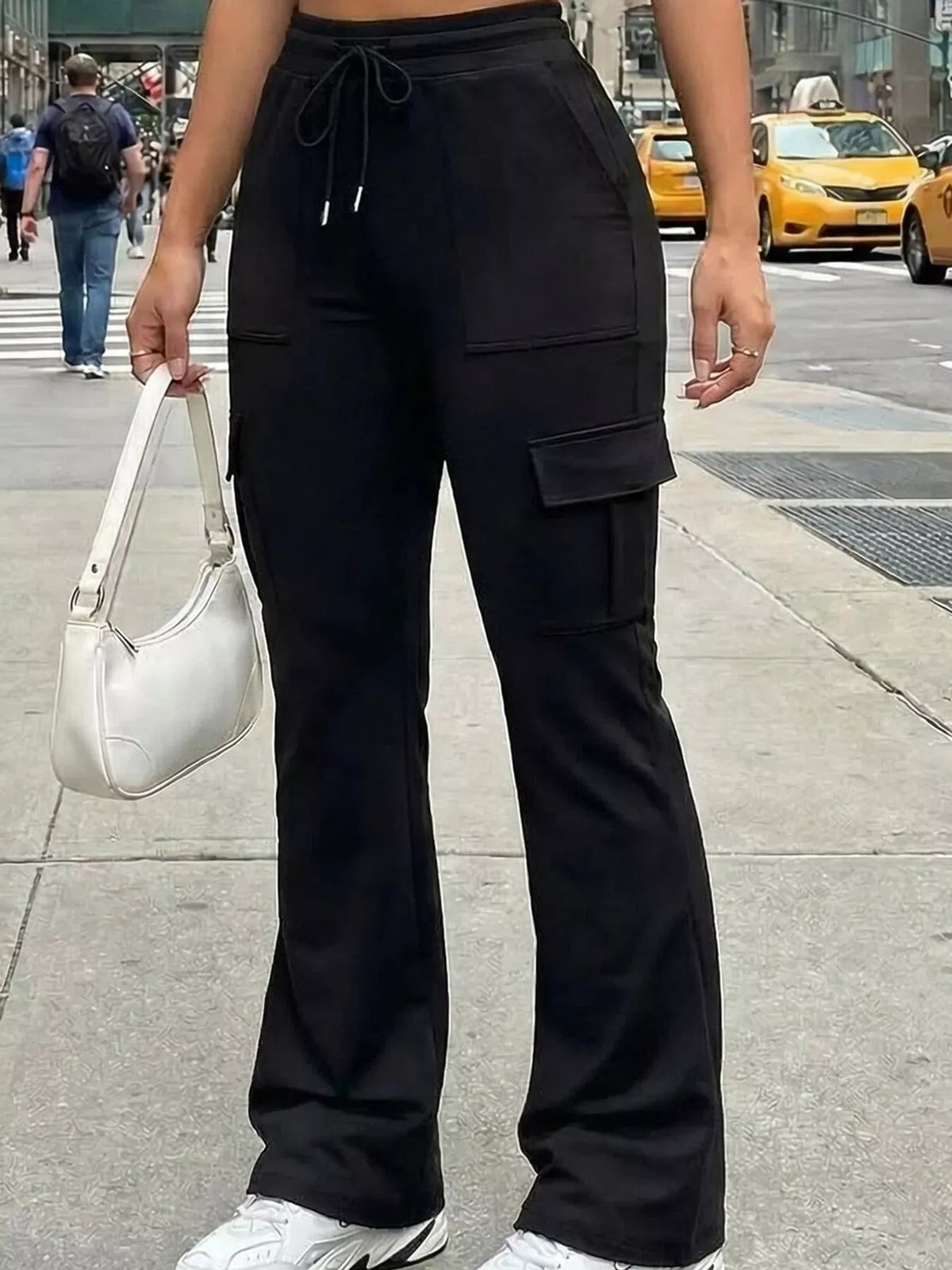 Black high-waisted slim-fit cargo flare pants with drawstring