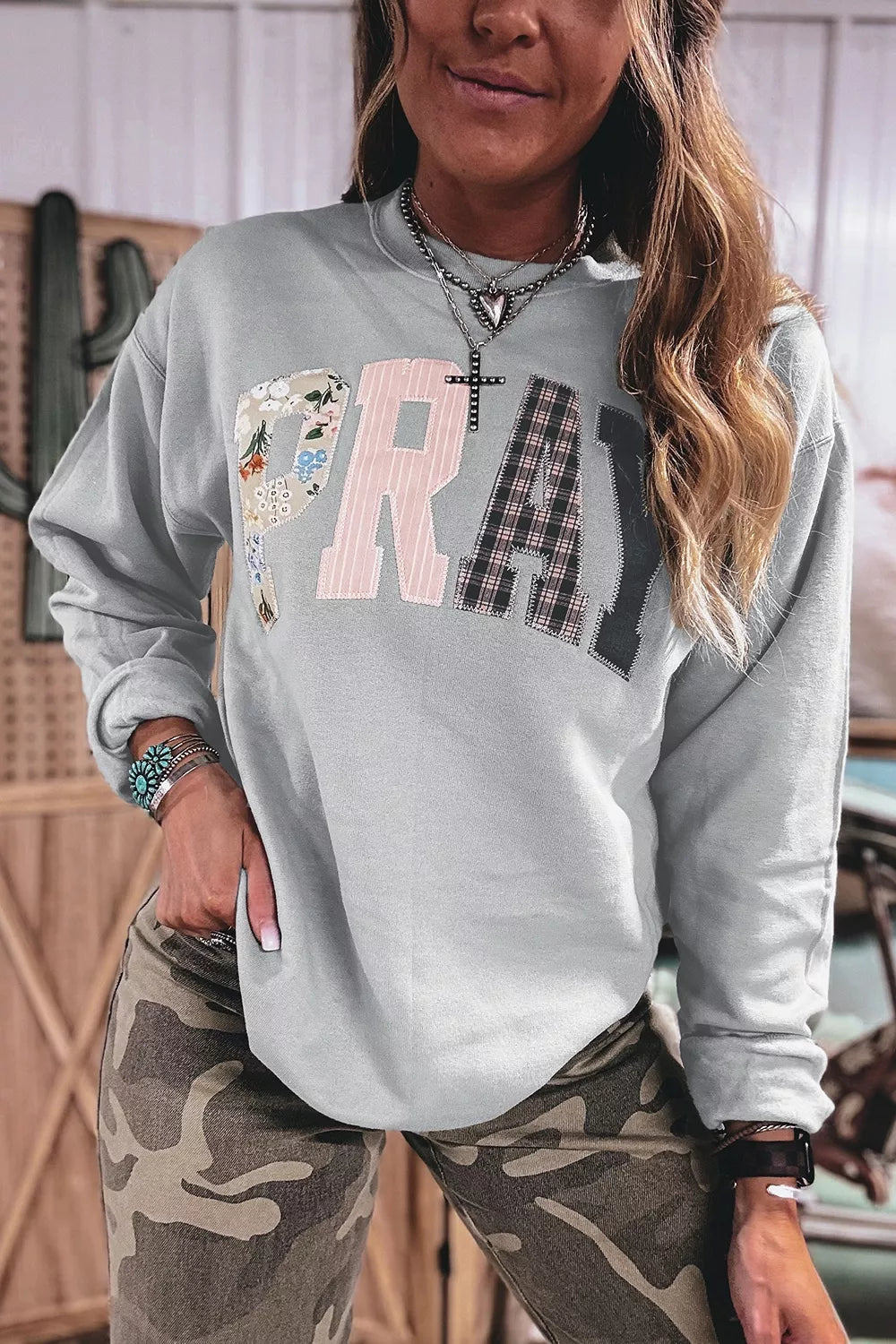 Gray floral and plaid PRAY patch sweatshirt, front view
