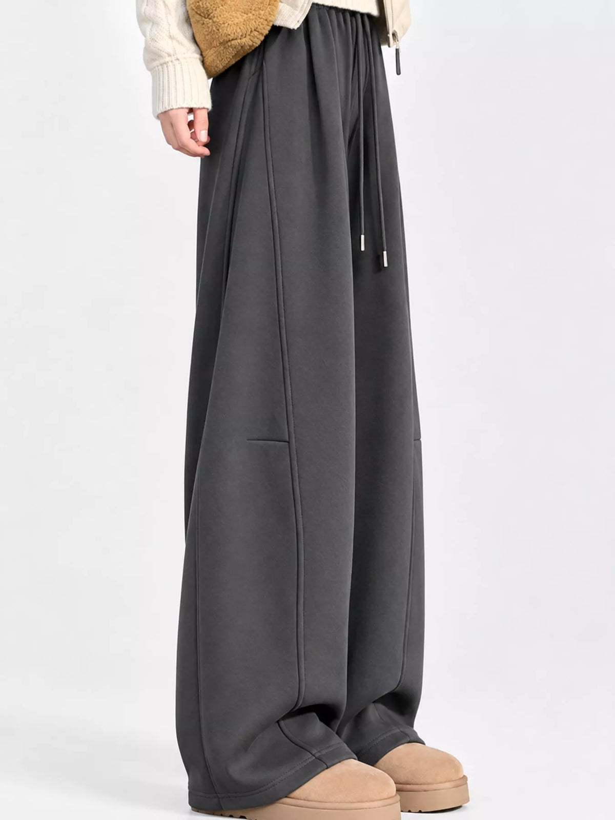 Dark gray wide leg drawstring sweatpants, side view
