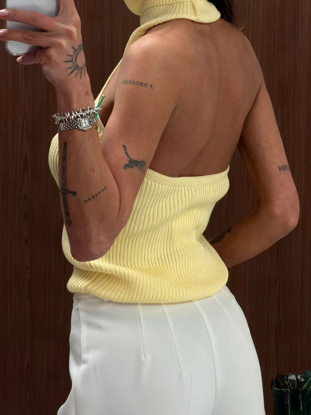 Yellow ribbed halter-neck tank, back view at an angle