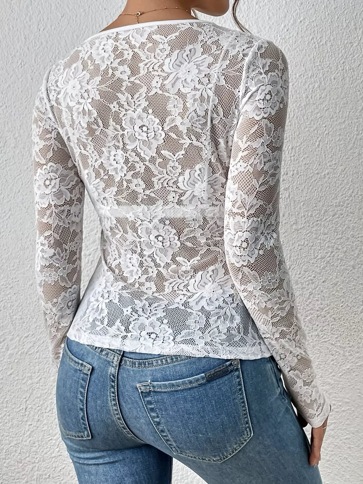 White sheer floral lace long sleeve top with scalloped V-neck, back view