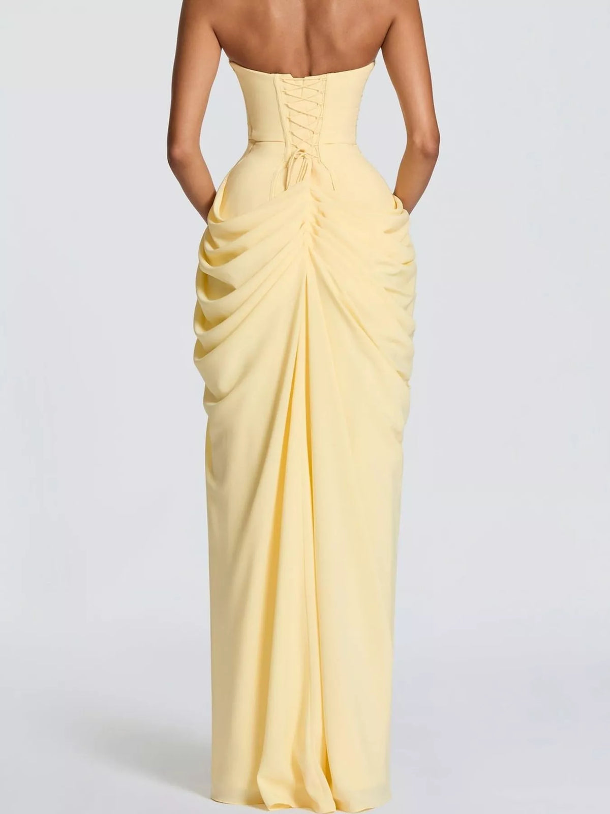 Yellow strapless ruched high-slit evening dress, back view