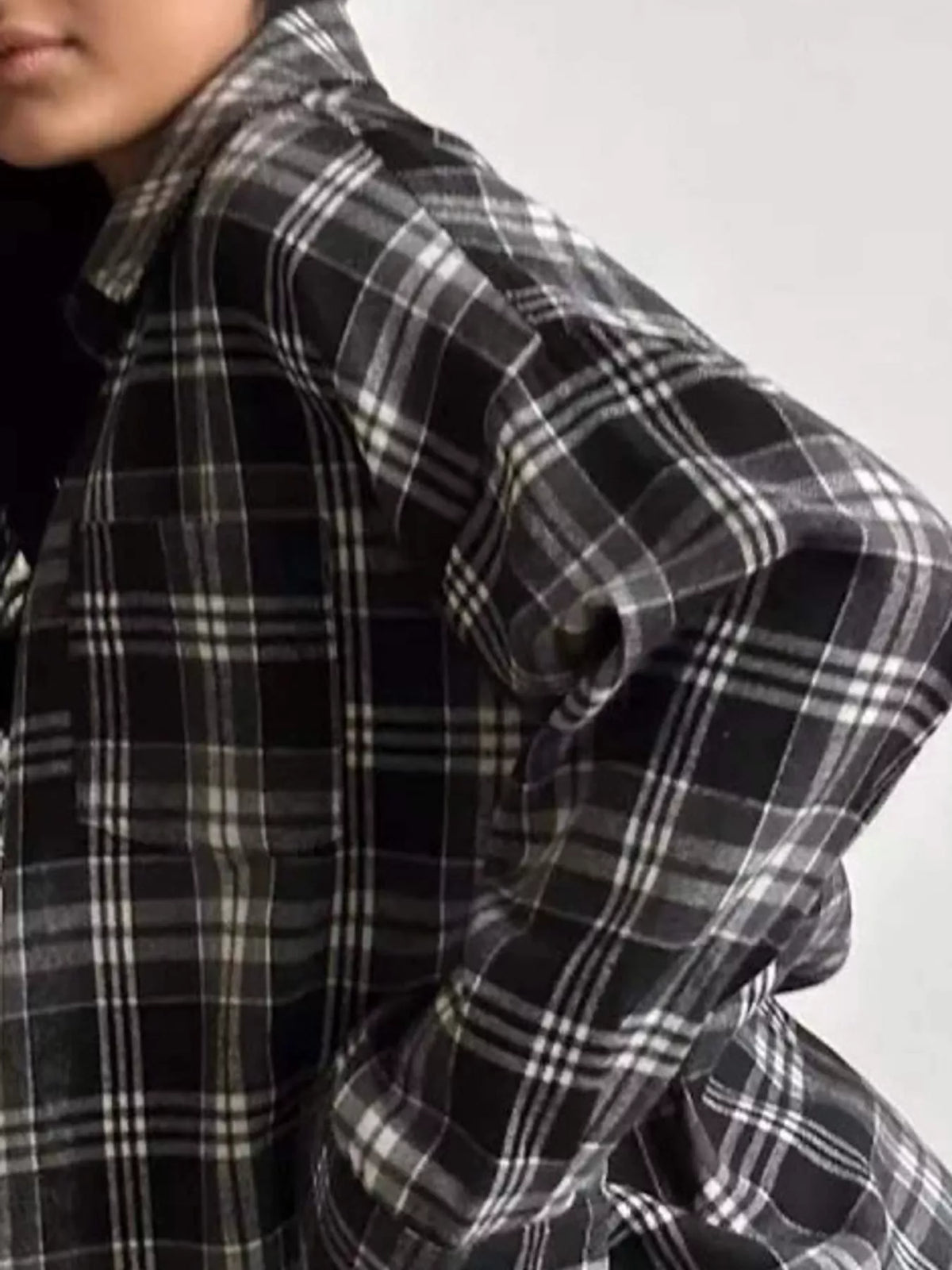 Black and white plaid button-up shirt with chest pockets