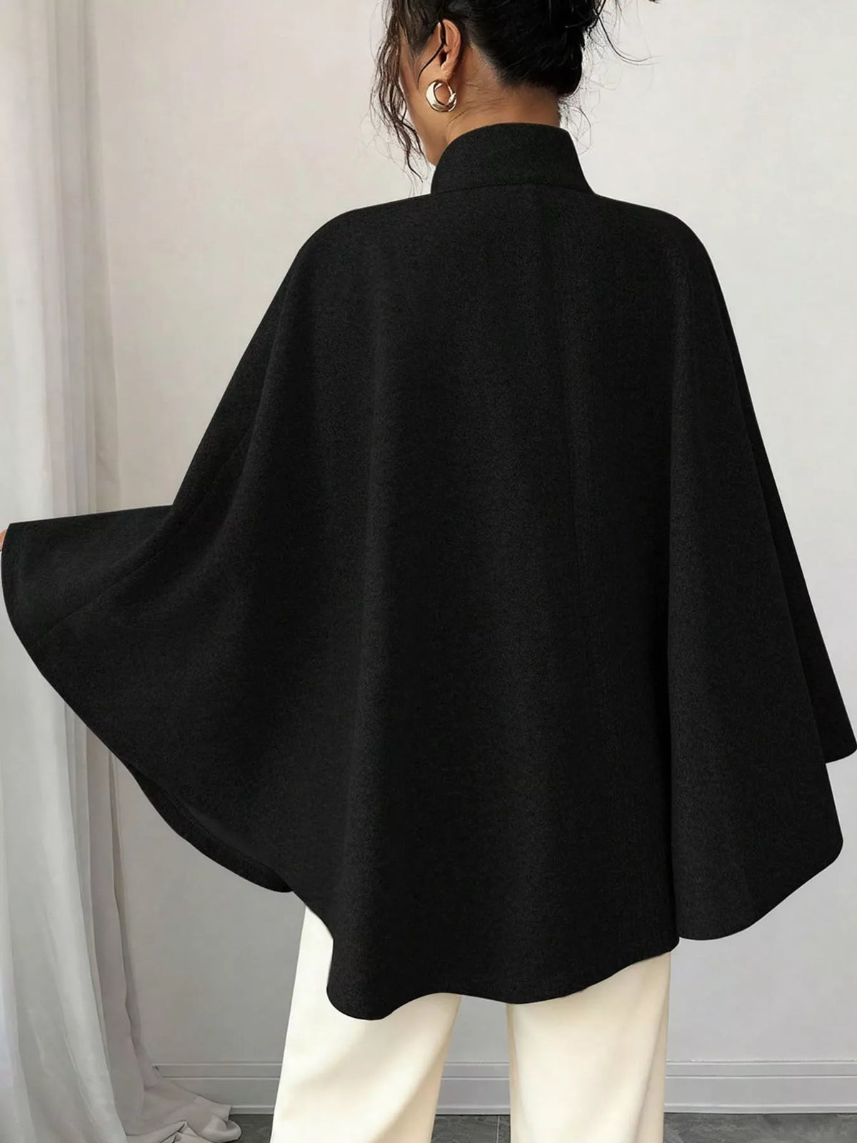 Black tie-waist cape — back view