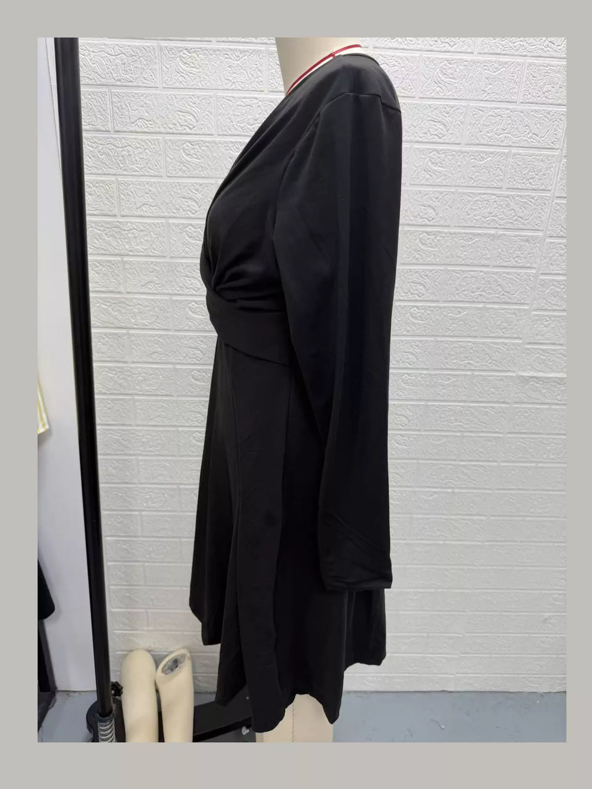 Black long sleeve ruched-front midi dress, side view