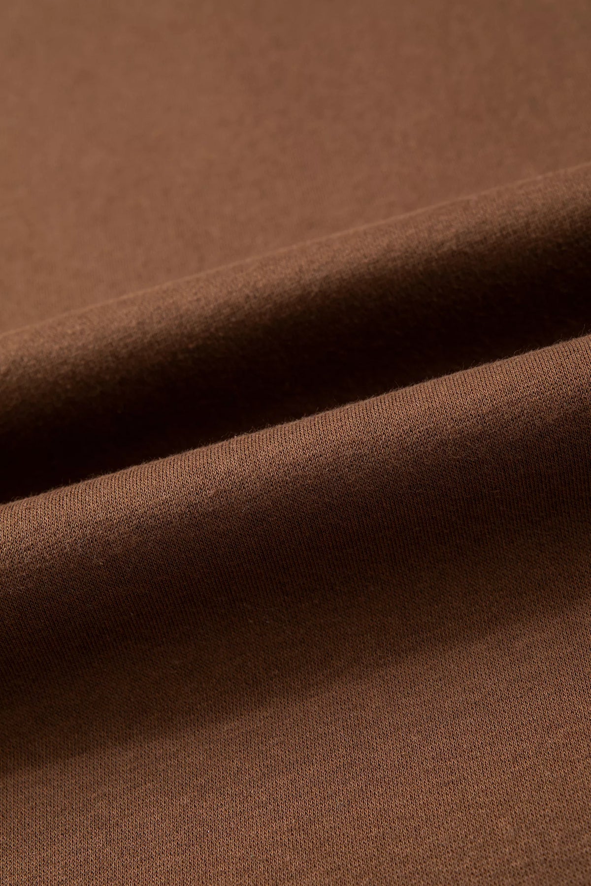 BLESSED sweatshirt, brown fabric surface