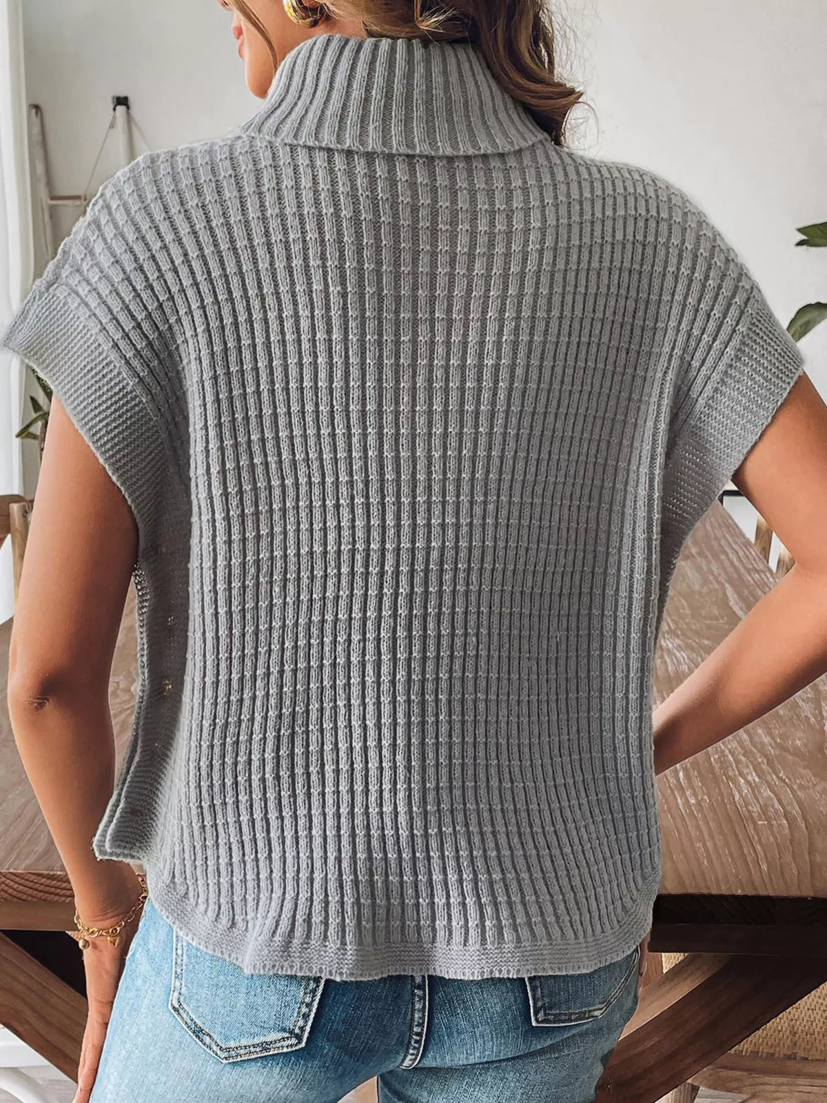 Gray ribbed turtleneck side-button sweater, back view.