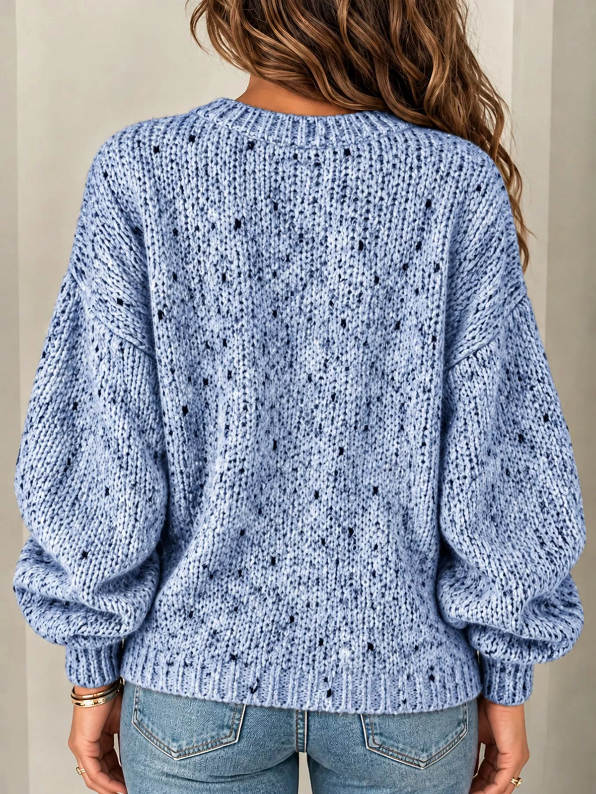 Light blue chunky knit round neck sweater, back view
