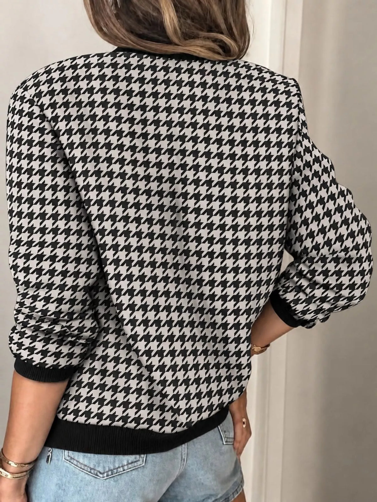 Black and white houndstooth printed zip-up bomber jacket — back view