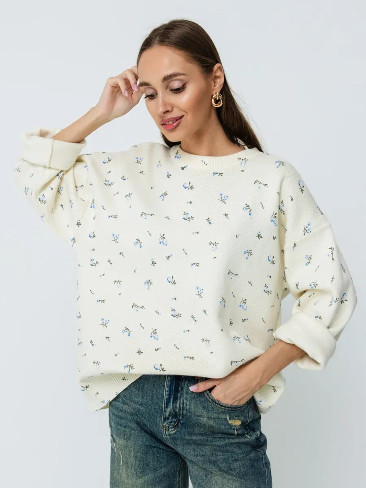 White floral dropped-shoulder oversized sweater, front view.