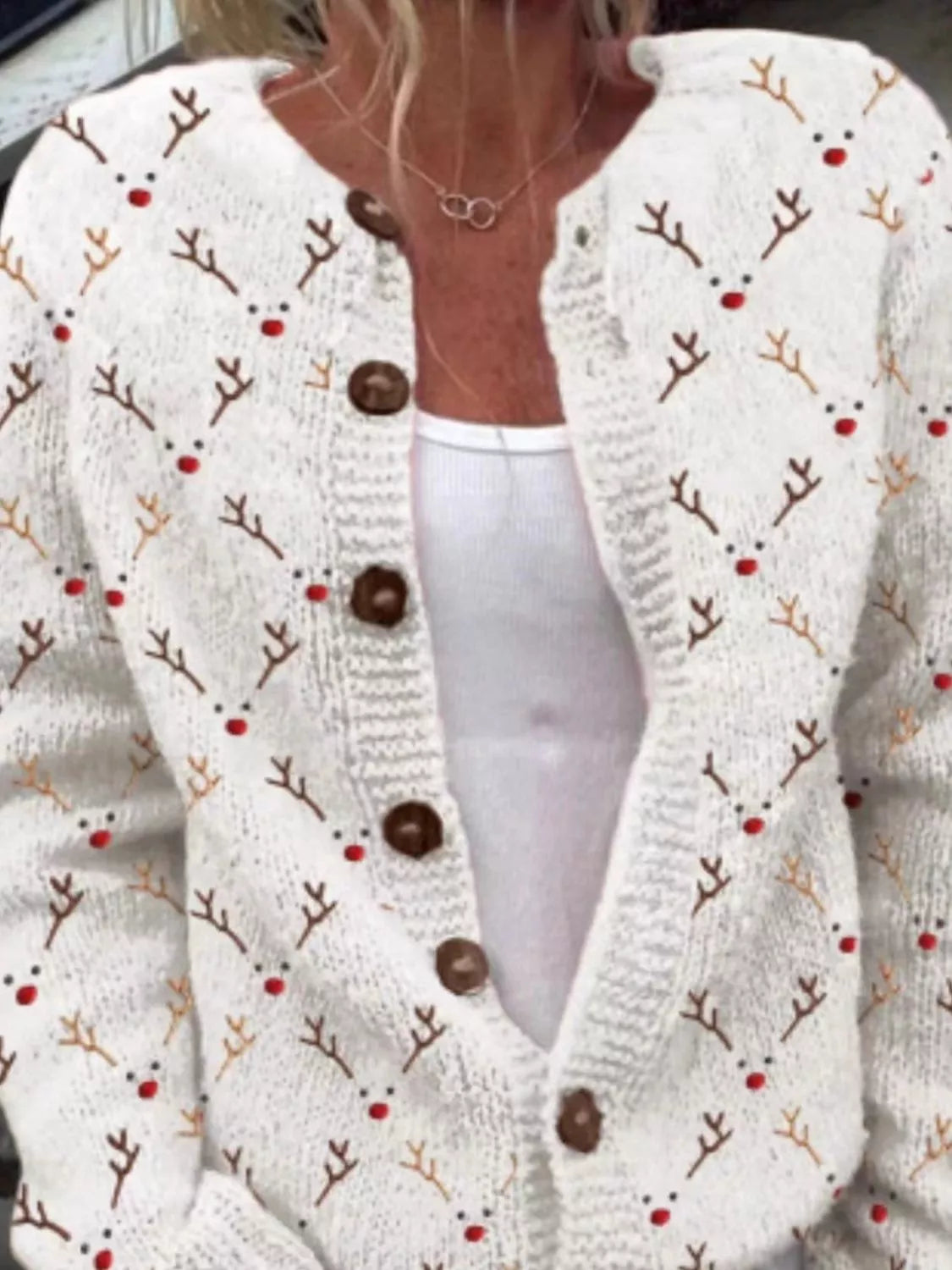 Christmas pattern button-down cardigan in white, front view with reindeer motifs