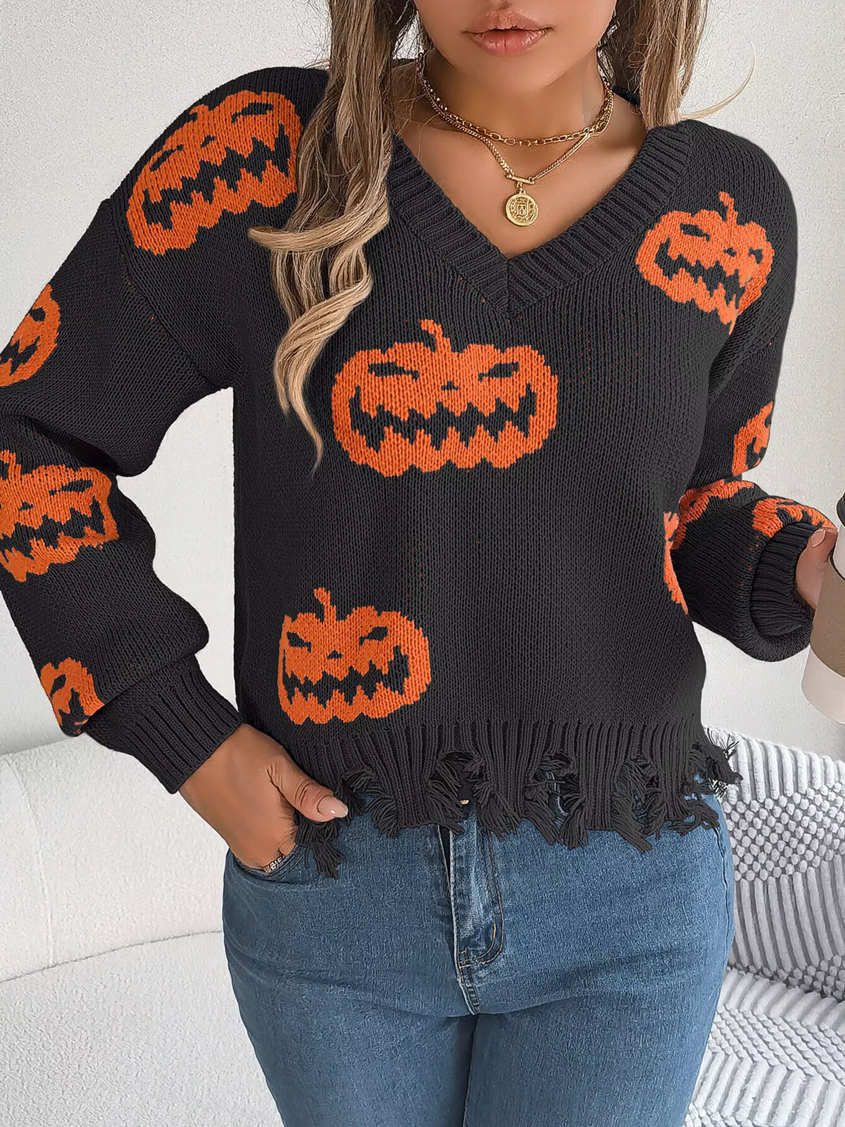 Pumpkin Distressed Hem Sweater in black, front view