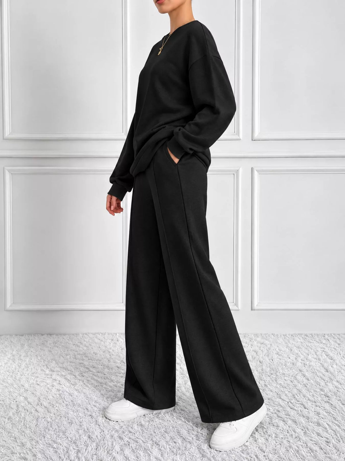 Black oversized sweatshirt and wide-leg pants set — side view