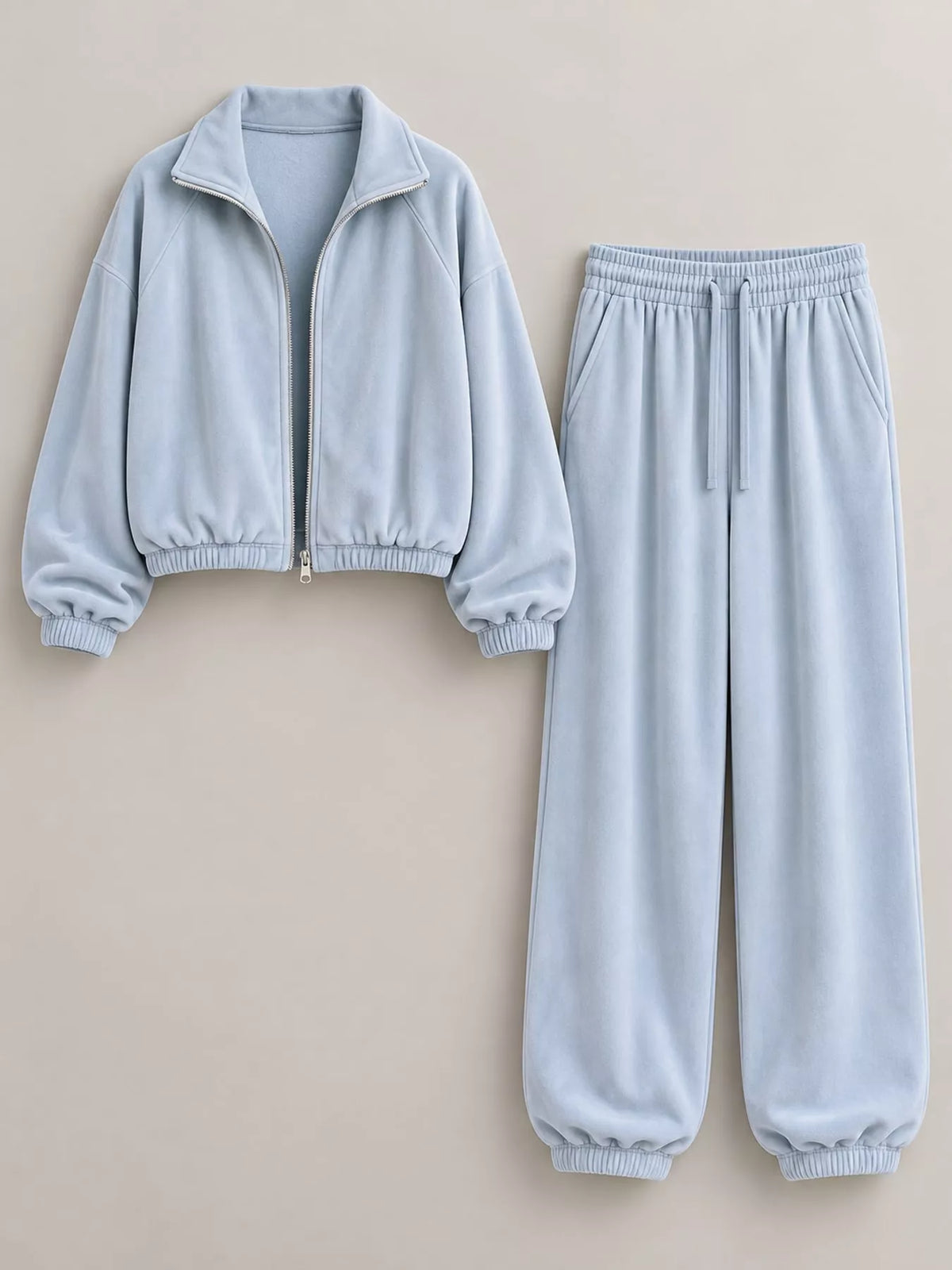 Light blue zip-up outerwear and pants set — front view