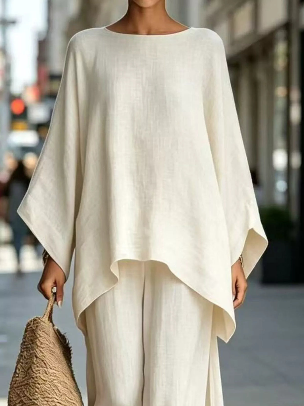 White batwing top, neckline and hem view